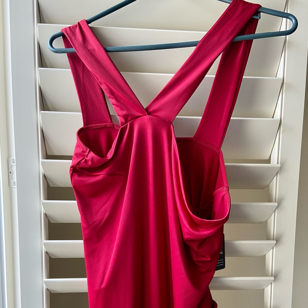 EXPRESS Thong Body Suit BNWT. Size Large Asymmetrical straps. Red. Snaps.